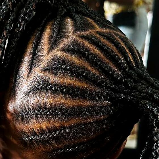 Close-up of evenly spaced triangle-part cornrows